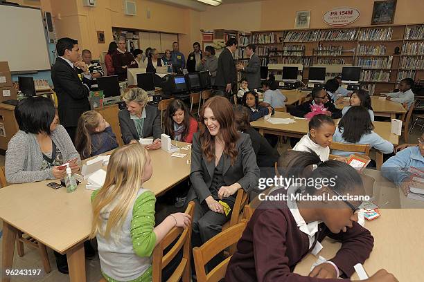 Actress Julianne Moore and Save the Children Board Vice Chair, Cokie Roberts interact with students honored during the Save The Children Valentine�s...