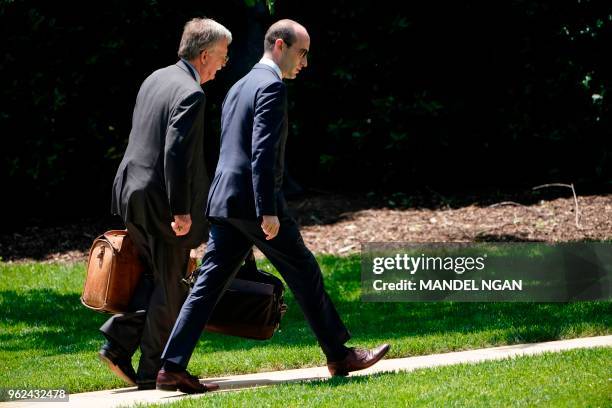 National Security Advisor John Bolton and Senior Advisor to the president Stephen Miller walk across the South Lawn upon return to the White House on...