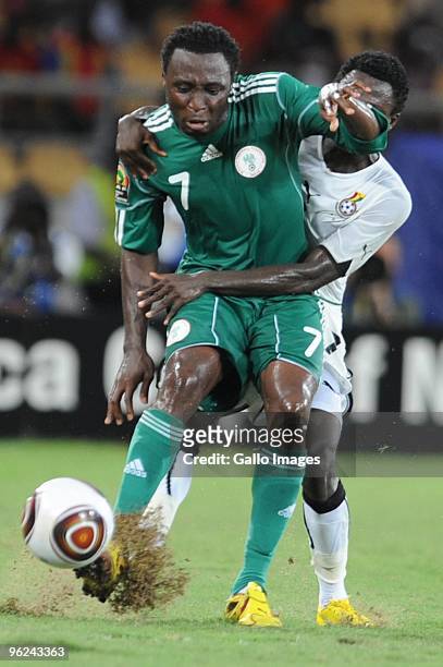 Chinedu Obasi of Nigeria and Samuel Inkoom of Ghana compete during the Africa Cup of Nations semi final match between Ghana and Nigeria from the...