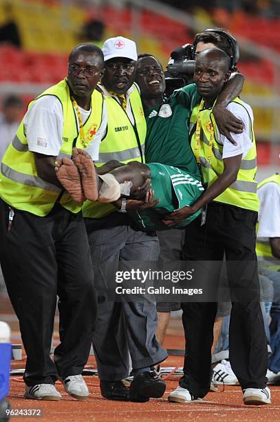 Yusuf Mohammed of Nigeria is carried after being injured during the Africa Cup of Nations semi final match between Ghana and Nigeria from the...