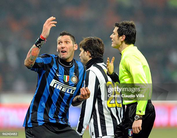 Marco Materazzi of FC Internazionale Milano and the referee Damato talk during the Tim Cup match between Inter and Juventus at Stadio Giuseppe Meazza...