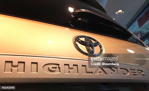 The logo and nameplate of a new Toyota Highlander is displayed on a vehicle at Bredemann Toyota in Park Ridge, Illinois, U.S., on Thursday, Jan. 28,...