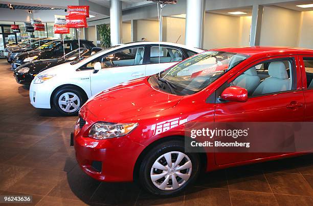 New Toyota Corolla, front, sits in the showroom at Bredemann Toyota in Park Ridge, Illinois, U.S., on Thursday, Jan. 28, 2010. Toyota Motor Corp.,...