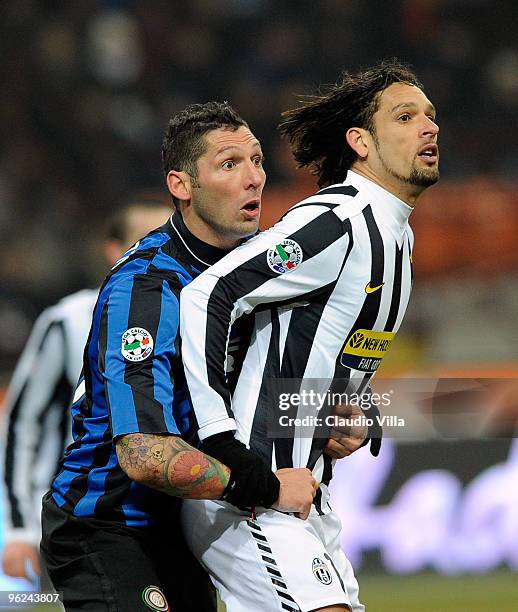 Marco Materazzi of FC Internazionale Milano competes for the ball with Amauri of Juventus FC during the Tim Cup match between Inter and Juventus at...