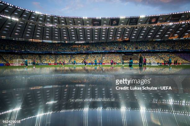 General view of the NSC Olimpiyskiy stadium is reflected in table during a Real Madrid training session ahead of the UEFA Champions League final...