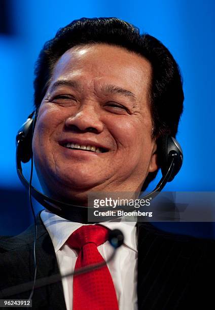 Nguyen Tan Dung, prime minister of Vietnam, laughs during a plenary session on day two of the 2010 World Economic Forum annual meeting in Davos,...