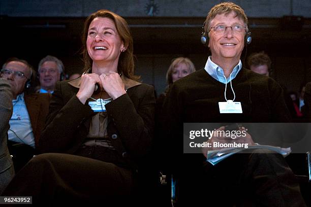 Bill Gates, founder of Microsoft Corp., right, and Melinda French Gates, co-founder of the Bill & Melinda Gates Foundation, listen during a plenary...