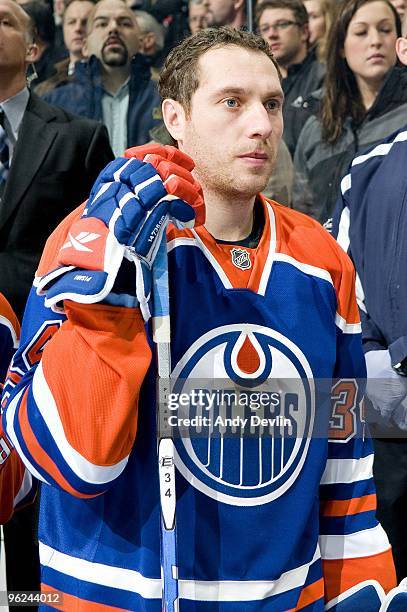 Fernando Pisani of the Edmonton Oilers stands for the National Anthems before a game against the Chicago Blackhawks at Rexall Place on January 26,...