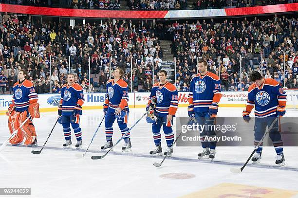 Jeff Deslauriers, Lubomir Visnovsky, Tom Gilbert, Andrew Cogliano, Dustin Penner and Sam Gagner of the Edmonton Oilers stand for the National Anthems...