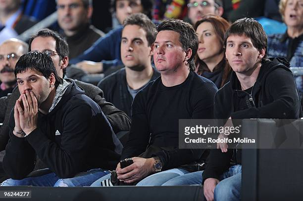 Lionel Messi of FC Barcelona and his brothers Matias and Rodrigo attend the Euroleague Basketball 2009-2010 Last 16 Game 1 between Regal FC Barcelona...