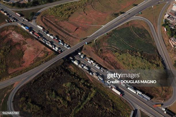 Aerial view of Brazilian truck drivers blocking the BR-262 highway with their trucks, during the fifth day of strike to protest against the diesel...