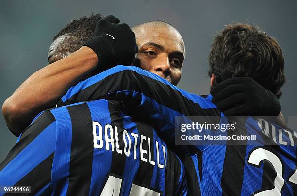 Mario Balotelli of Inter Milan is congratulated by Sisenando Maicon Douglas and Diego Milito of Inter Milan after scoring Inter Milan's second goal...