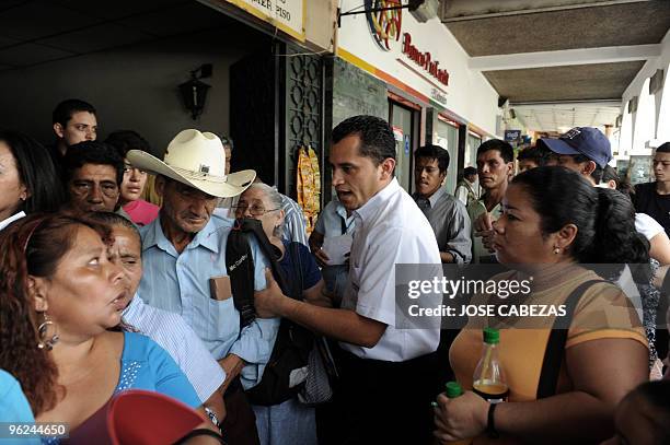 Salvadoreans line up to get their ID card issued at a center in the suburb of Santa Tecla, San Salvador, January 28, 2010. The first of the 3,8...