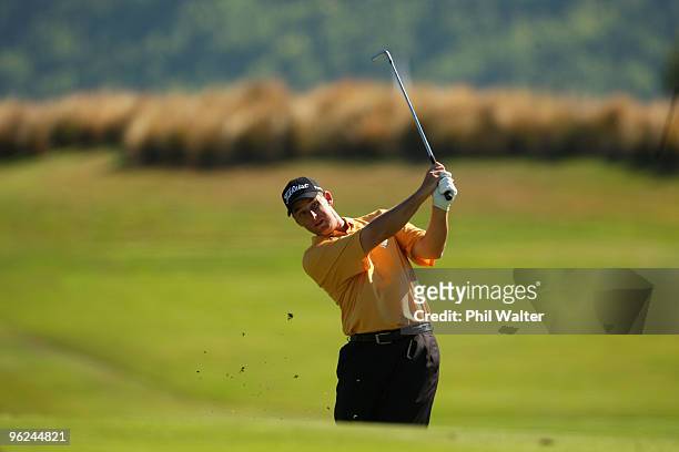 Darron Stiles of the USA plays an approach shot on the 14th hole during day two of the New Zealand Open at The Hills Golf Club on January 29, 2010 in...