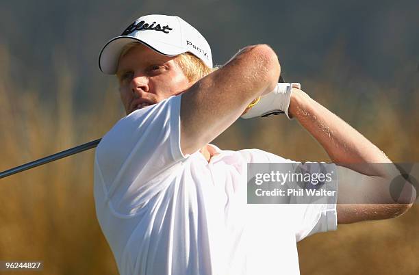 Andrew Dodt of Australia tees off on the 14th hole during day two of the New Zealand Open at The Hills Golf Club on January 29, 2010 in Queenstown,...