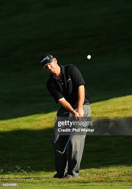 Ted Brown of the USA chips onto the 13th green during day two of the New Zealand Open at The Hills Golf Club on January 29, 2010 in Queenstown, New...