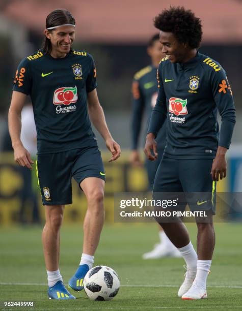 Brazil's players Filipe Luis and William attend a training session of the national football team ahead of the FIFA 2018 World Cup, at Granja Comary...