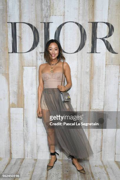 Aimee Song poses at a photocall during Christian Dior Couture S/S19 Cruise Collection on May 25, 2018 in Chantilly, France.