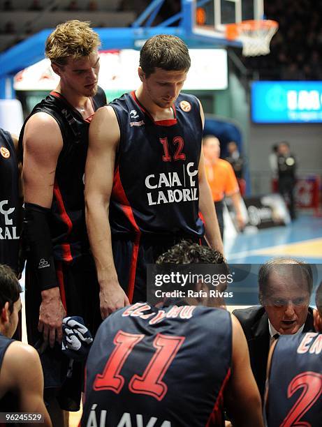 Head Coach Dusko Ivanovic of Caja Laboral gives instructions to his team next to Tiago Splitter, #21 of Caja Laboral and Mirza Teletovic, #12 of Caja...