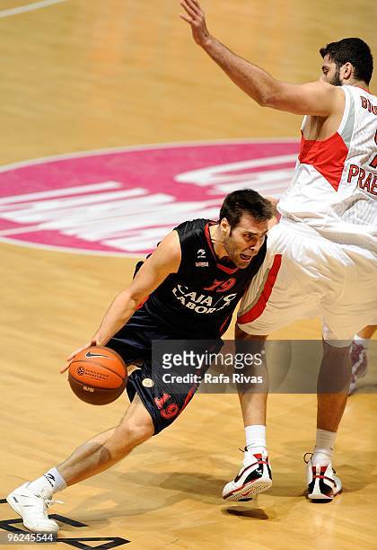 Fernando San Emeterio, #19 of Caja Laboral competes with Ioannis Bourousis, #9 of Olympiacos Piraeus during the Euroleague Basketball 2009-2010 Last...