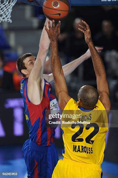 Fran Vazquez, #17 of Regal FC Barcelona competes with Jamon Lucas, #22 of Maroussi BC during the Euroleague Basketball 2009-2010 Last 16 Game 1...