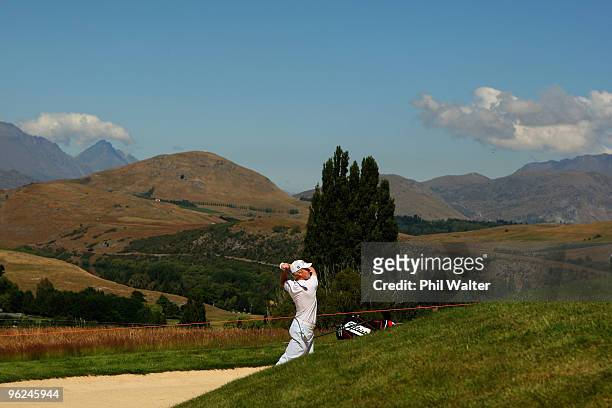 Andrew Dodt of Australia plays out of a bunker on the 18th hole during day two of the New Zealand Open at The Hills Golf Club on January 29, 2010 in...