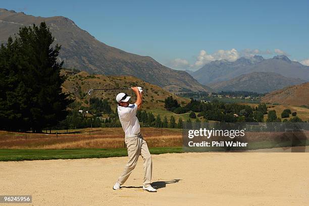 Brian Vranesh of the USA plays out of a bunker on the 18th hole during day two of the New Zealand Open at The Hills Golf Club on January 29, 2010 in...