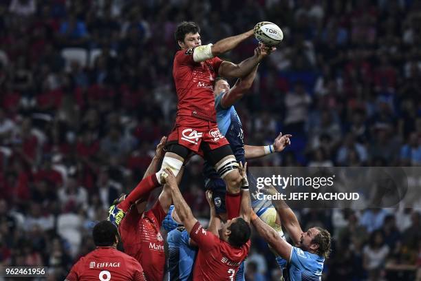 Lyon's French flanker Julien Puricelli vies with Montpellier's French lock Paul Willemse during the French Top 14 union semi-final rugby match...