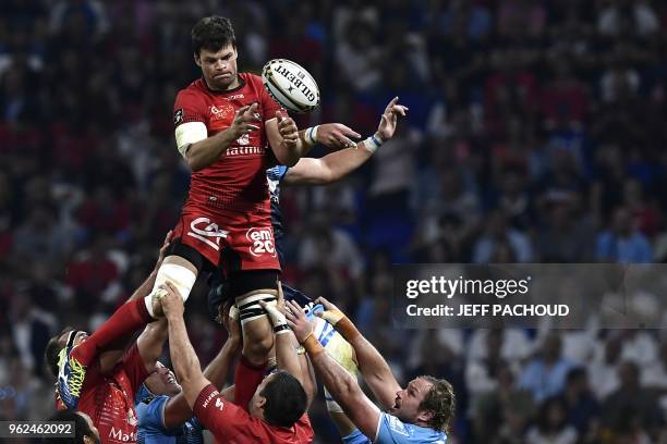 Lyon's French flanker Julien Puricelli vies with Montpellier's French lock Paul Willemse during the French Top 14 union semi-final rugby match...