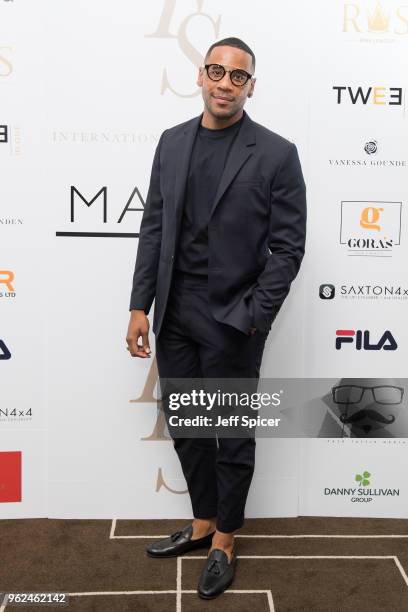 Television presenter Reggie Yates attends the inaugural International Fashion Show at Rosewood Hotel on May 25, 2018 in London, England.