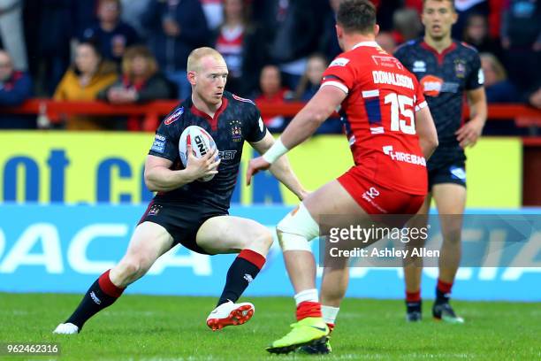 Liam Farrell of Wigan Warriors looks for a gap to run through during the Betfred Super League at KCOM Craven Park on May 25, 2018 in Hull, England.