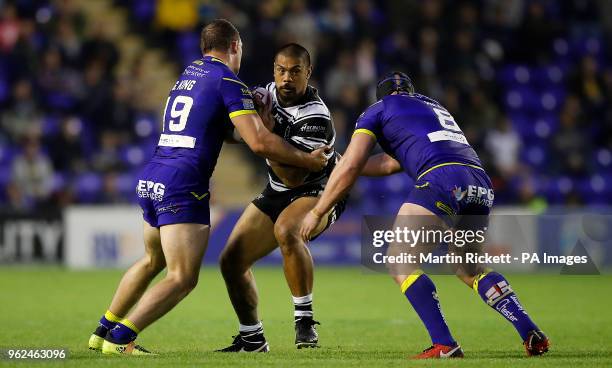 Hull FC's Sika Manu is tackled by Warrington Wolves' George King and Chris Hill during the Betfred Super League match at the Halliwell Jones Stadium,...