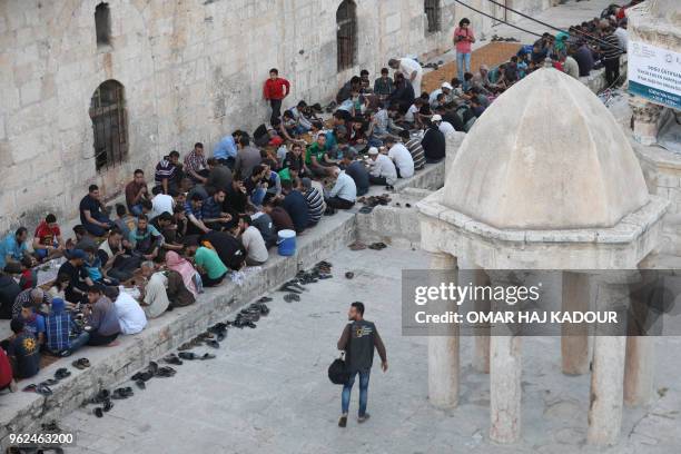 Some eight hundred people break the Ramadan fast during an event organized by "The Charity Foundation" for the displaced people of Ghouta and the...