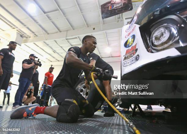 Jerick Newsome changes a tire during the NASCAR Drive for Diversity Combine at the NASCAR Research and Development Center on May 25, 2018 in Concord,...