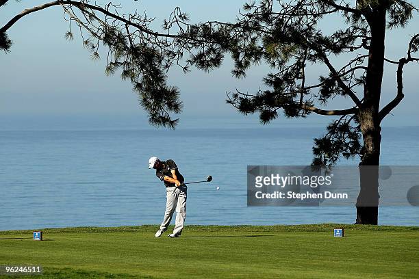 Greg Owen of England hits his tee shot on the second hole at the North Course at Torrey Pines Golf Course during the first round of the Farmers...