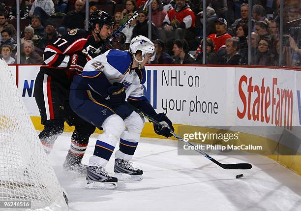 Patrik Berglund of the St. Louis Blues controls the puck against Filip Kuba of the Ottawa Senators in a game at Scotiabank Place on January 21, 2010...