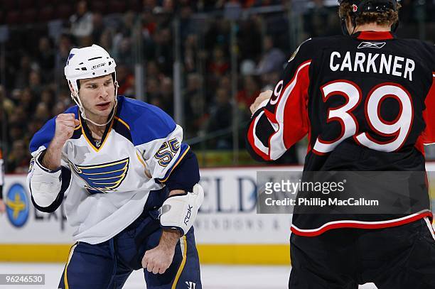 Cam Janssen of the St. Louis Blues puts his fists up against Matt Carkner of the Ottawa Senators in a game at Scotiabank Place on January 21, 2010 in...