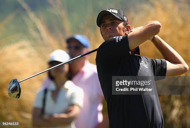 Scott Arnold of Australia tees off on the 14th hole during day two of the New Zealand Open at The Hills Golf Club on January 29, 2010 in Queenstown,...