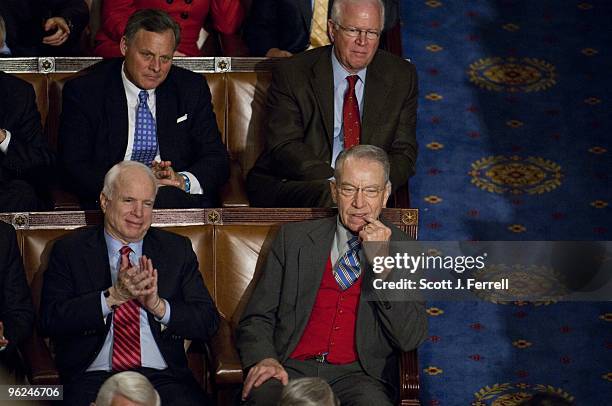 Sen. John McCain, R-Ariz., and Sen. Charles E. Grassley, R-Iowa, as President Barack Obama delivers his first State of the Union address to a joint...