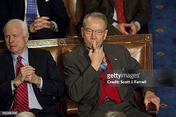 Sen. John McCain, R-Ariz., and Sen. Charles E. Grassley, R-Iowa, as President Barack Obama delivers his first State of the Union address to a joint...