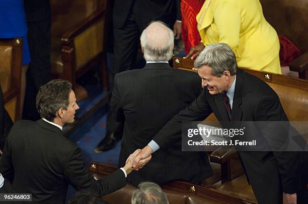 Treasury Secretary Timothy F. Geithner and Senate Finance Chairman Max Baucus, D-Mont., shake hands before President Barack Obama delivers his first...