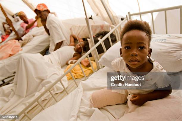 In this handout image provided by the United Nations Stabilization Mission in Haiti , a child sits on a bed at the hospital January 28, 2010 in...