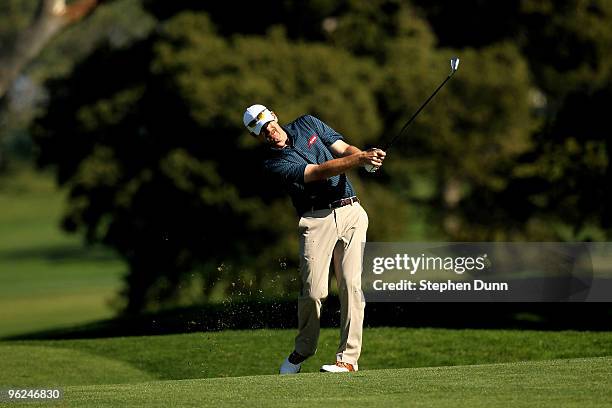 Tom Gillis hits his second shot on the fifth hole at the North Course atTorrey Pines Golf Course during the first round of the Farmers Insurance Open...