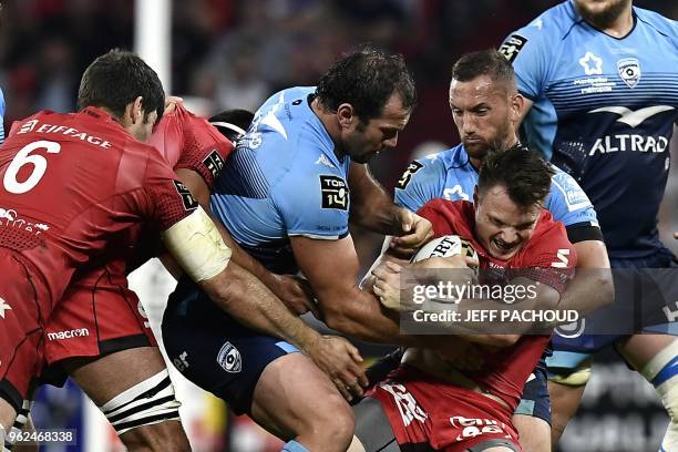 Montpellier's New Zealand fly half Aaron Cruden vies with Lyon's New Zealander winger Toby Arnold during the French Top 14 union semi-final rugby...