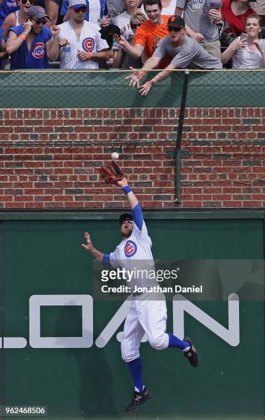 Ben Zobrist of the Chicago Cubs leps to make a catch at the wall on a ball hit by Brandon Belt of the San Francisco Giants in the 6th inning at...