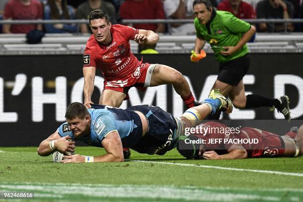 Montpellier's French lock Paul Willemse scores a try during the French Top 14 union semi-final rugby match between Montpellier and Lyon on May 25,...