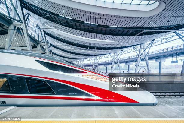 modern high speed trains in beijing, china - high speed train stock pictures, royalty-free photos & images