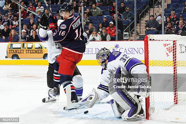 Derick Brassard of the Columbus Blue Jackets acts as a screen as goaltender Jonathan Quick of the Los Angeles Kings stops a shot during the first...
