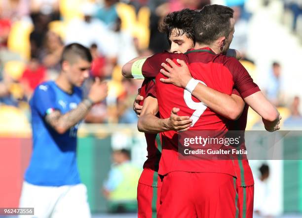 Portugal and SL Benfica forward Diogo Goncalves celebrates with teammates after scoring a goal during the U21 International Friendly match between...