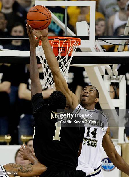 Derrick Favors of the Georgia Tech Yellow Jackets blocks a shot by Al-Farouq Aminu of the Wake Forest Demon Deacons at Alexander Memorial Coliseum on...